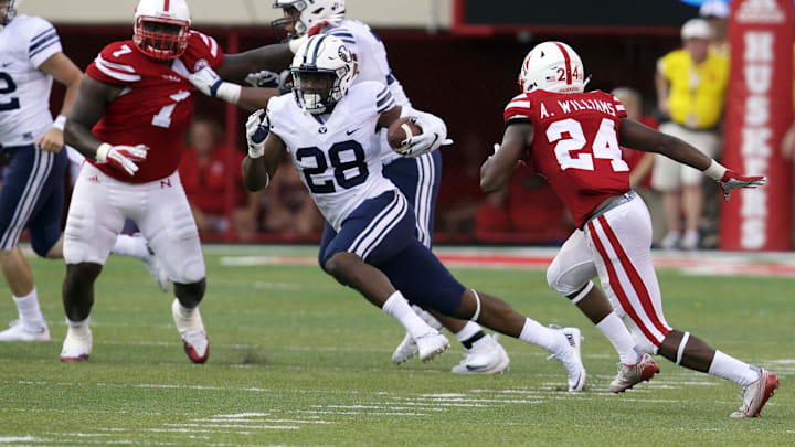 Sep 5, 2015; Lincoln, NE, USA; Brigham Young Cougars running back Adam Hine (28) runs against the Nebraska Cornhuskers in the second half at Memorial Stadium. Brigham Young won 33-28. Mandatory Credit: Bruce Thorson-Imagn Images Sep 5, 2015; Lincoln, NE, USA; Brigham Young Cougars running back Adam Hine (28) runs against the Nebraska Cornhuskers in the second half at Memorial Stadium. Brigham Young won 33-28. Mandatory Credit: Bruce Thorson-Imagn Images