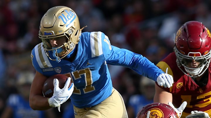 Nov 18, 2023; Los Angeles, California, USA; UCLA Bruins wide receiver Logan Loya (17) runs after a catch against USC Trojans safety Jaylin Smith (19) during the third quarter at United Airlines Field at Los Angeles Memorial Coliseum. Mandatory Credit: Jason Parkhurst-Imagn Images Nov 18, 2023; Los Angeles, California, USA; UCLA Bruins wide receiver Logan Loya (17) runs after a catch against USC Trojans safety Jaylin Smith (19) during the third quarter at United Airlines Field at Los Angeles Memorial Coliseum. Mandatory Credit: Jason Parkhurst-Imagn Images