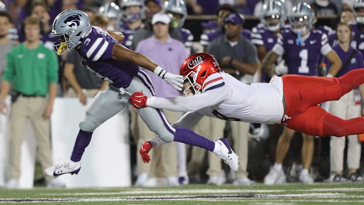 Arizona's Sterling Lane II tries to bring down Kansas State running back Dylan Edwards. Lane II committed to Boise State on Saturday. 