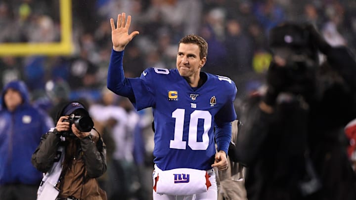 New York Giants quarterback Eli Manning (10) waves to the fans as he exits the field at MetLife Stadium for the last time in his career. New York Giants quarterback Eli Manning (10) waves to the fans as he exits the field at MetLife Stadium for the last time in his career.