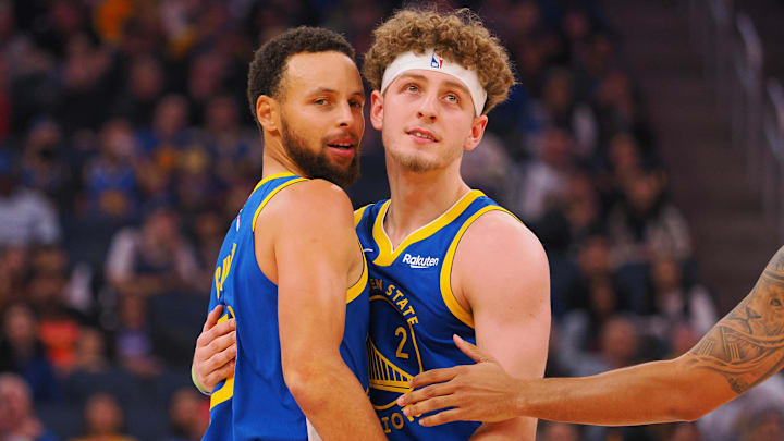 Nov 30, 2023; San Francisco, California, USA; Golden State Warriors guard Stephen Curry (30) is held back by guard Brandin Podziemski (2) after being called for a foul against the Los Angeles Clippers during the first quarter at Chase Center. Mandatory Credit: Kelley L Cox-USA TODAY Sports