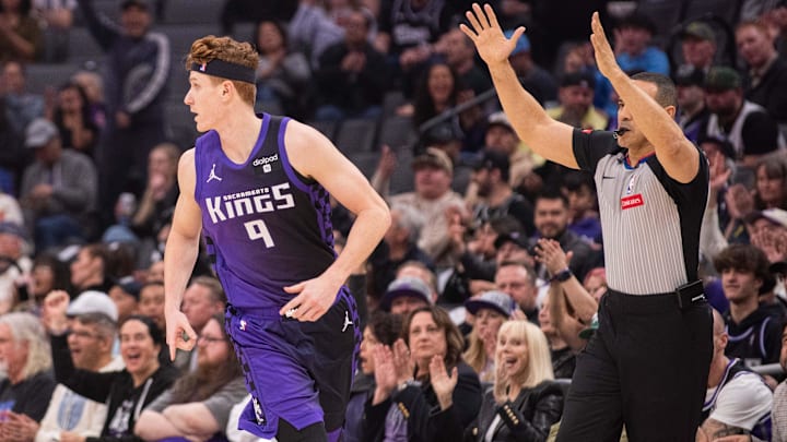 Mar 12, 2024; Sacramento, California, USA; Sacramento Kings guard Kevin Huerter (9) jogs up the court after making a three-point basket during the first quarter at Golden 1 Center. Mandatory Credit: Ed Szczepanski-Imagn Images