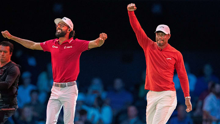 Tiger Woods and Akshay Bhatia of Jupiter Links GC celebrate the win over Boston Common Golf during TGL match at SoFi Center on March 17, 2026, in Palm Beach Gardens, Florida.