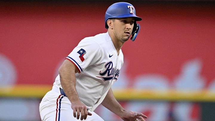 Texas Rangers left fielder Wyatt Langford prepares to run from second base.
