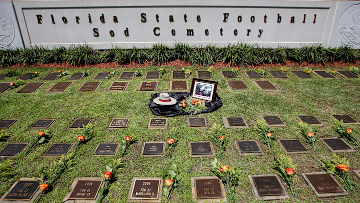 Former Florida State coach Bobby Bowden's hat, a portrait and flowers is displayed inside the sod cemetery on the FSU campus Friday, Aug. 13, 2021.

Fsu Sod Cemetery007