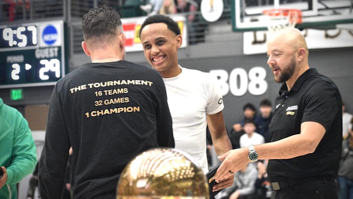 Jeremiah Harshman accepts the Deonte Strickland Mr. Hustle award after hitting a buzzer-beating 3 to finish third in the 2024 Les Schwab Invitational.