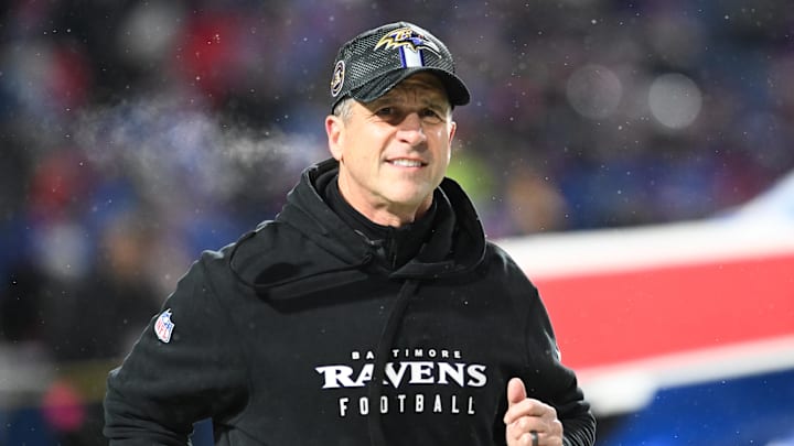 Baltimore Ravens head coach John Harbaugh takes the field before the game against the Buffalo Bills.