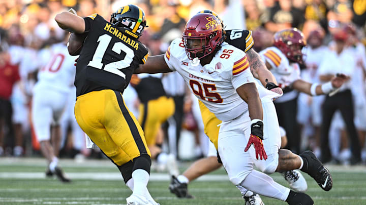 Sep 7, 2024; Iowa City, Iowa, USA; Iowa State Cyclones defensive lineman Domonique Orange (95) sacks Iowa Hawkeyes quarterback Cade McNamara (12) during the fourth quarter at Kinnick Stadium. Mandatory Credit: Jeffrey Becker-Imagn Images