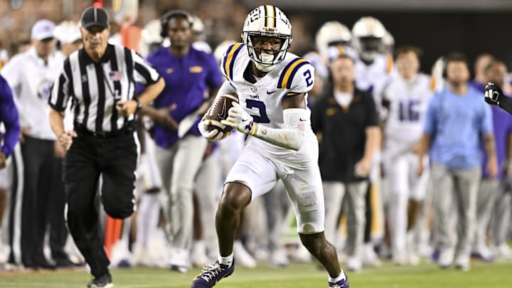Oct 26, 2024; College Station, Texas, USA; LSU Tigers wide receiver Kyren Lacy (2) runs the ball during the second quarter against the Texas A&M Aggies. The Aggies defeated the Tigers 38-23; at Kyle Field. Mandatory Credit: Maria Lysaker-Imagn Images.  
