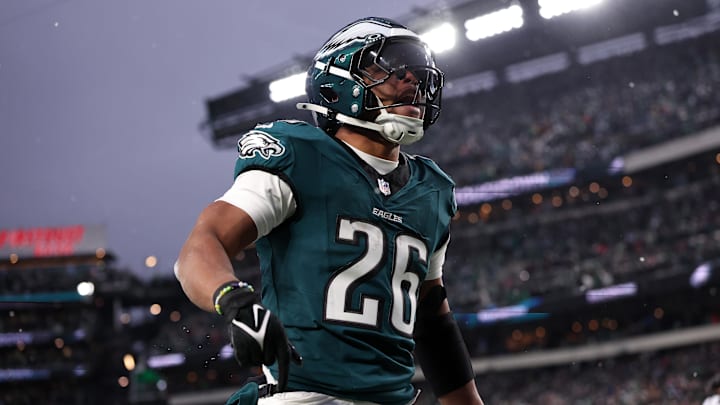 Jan 19, 2025; Philadelphia, Pennsylvania, USA; Philadelphia Eagles running back Saquon Barkley (26) celebrates after scoring a touchdown against the Los Angeles Rams in the first half in a 2025 NFC divisional round game at Lincoln Financial Field. Mandatory Credit: Bill Streicher-Imagn Images