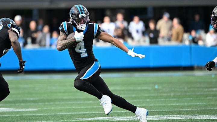 Dec 21, 2025; Charlotte, North Carolina, USA; Carolina Panthers wide receiver Tetairoa McMillan (4) with the ball in the third quarter at Bank of America Stadium. Mandatory Credit: Bob Donnan-Imagn Images