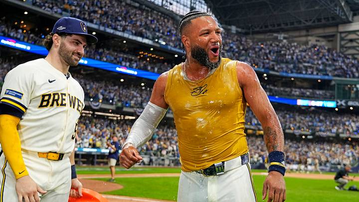 Oct 4, 2026; Milwaukee, Wisconsin, USA; Milwaukee Brewers outfielder Jackson Chourio (11) celebrates with the team after hitting the game-winning play against the San Diego Padres in game two of the NLDS for the 2026 MLB Playoffs at American Family Field. Mandatory Credit: Michael McLoone-Imagn Images Oct 4, 2026; Milwaukee, Wisconsin, USA; Milwaukee Brewers outfielder Jackson Chourio (11) celebrates with the team after hitting the game-winning play against the San Diego Padres in game two of the NLDS for the 2026 MLB Playoffs at American Family Field. Mandatory Credit: Michael McLoone-Imagn Images