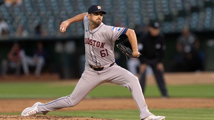 Jul 23, 2024; Oakland, California, USA;  Houston Astros pitcher Seth Martinez (61) pitches during the sixth inning against the Oakland Athletics at Oakland-Alameda County Coliseum. Mandatory Credit: Stan Szeto-Imagn Images