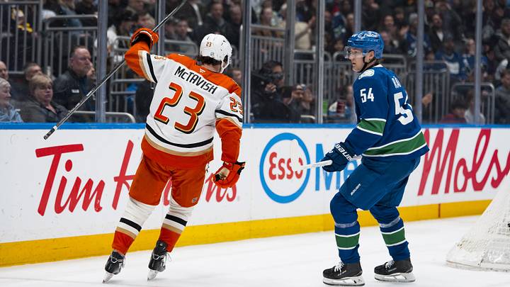 Mar 24, 2026; Vancouver, British Columbia, CAN; Vancouver Canucks forward Aatu Raty (54) reacts as Anaheim Ducks forward Mason McTavish (23) celebrates his goal in the third period at Rogers Arena. Mandatory Credit: Bob Frid-Imagn Images