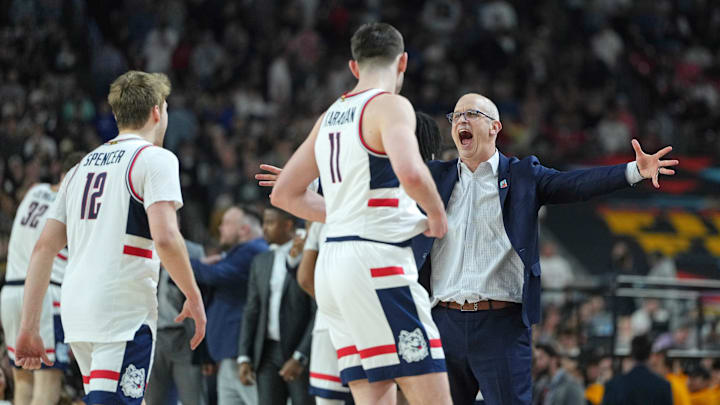 Apr 8, 2024; Glendale, AZ, USA; Connecticut Huskies head coach Dan Hurley celebrates with guard Cam Spencer (12) and forward Alex Karaban (11) during the second half of the national championship game of the Final Four of the 2024 NCAA Tournament at State Farm Stadium. Mandatory Credit: Bob Donnan-Imagn Images
