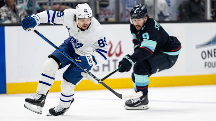 Feb 6, 2025; Seattle, Washington, USA;  Toronto Maple Leafs forward Nicholas Robertson (89) skates against Seattle Kraken forward Chandler Stephenson (9) during the second periodat Climate Pledge Arena. Mandatory Credit: Stephen Brashear-Imagn Images