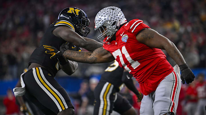 Dec 29, 2023; Arlington, TX, USA; Ohio State Buckeyes offensive lineman Josh Simmons (71) blocks Missouri Tigers defensive lineman Darius Robinson (6) during the second quarter at AT&T Stadium.