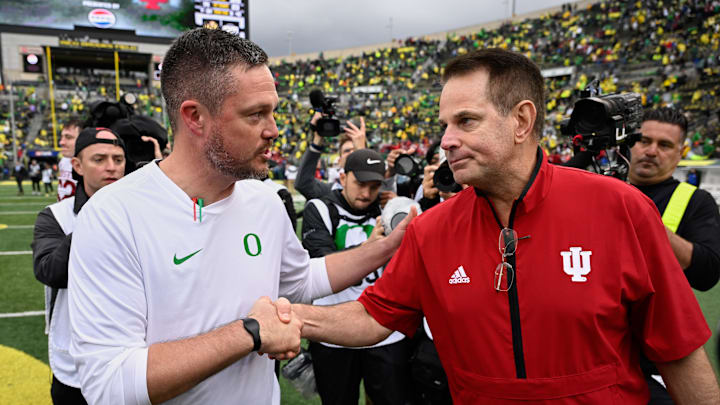 Dan Lanning and Curt Cignetti shake hands after Indiana's win over Oregon on Sunday.