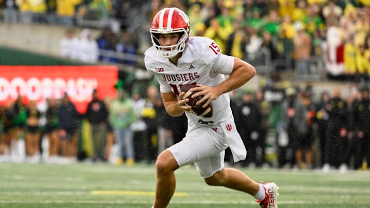 Oct 11, 2025; Eugene, Oregon, USA; Indiana Hoosiers quarterback Fernando Mendoza (15) runs with the ball against the Oregon Ducks during the fourth quarter at Autzen Stadium. Mandatory Credit: Troy Wayrynen-Imagn Images