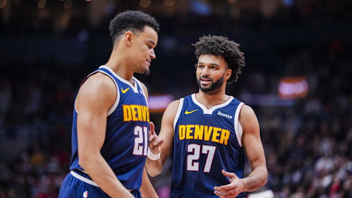 Dec 31, 2025; Toronto, Ontario, CAN; Denver Nuggets guard Jamal Murray (27) stands beside forward Spencer Jones (21) during a break in play against the Toronto Raptors during the second half at Scotiabank Arena. Mandatory Credit: Kevin Sousa-Imagn Images