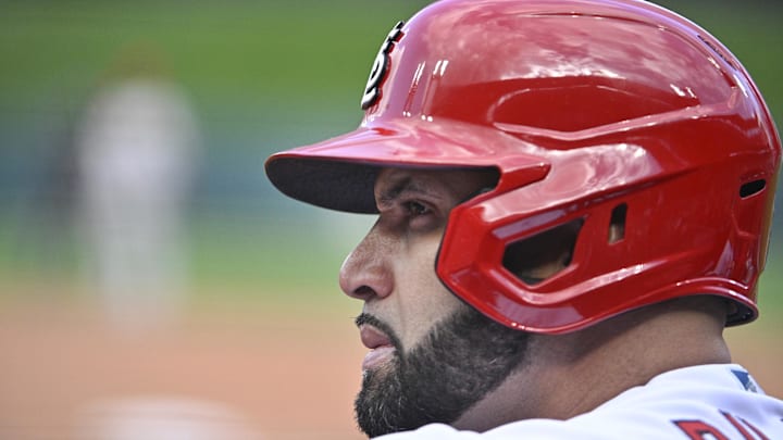 Oct 7, 2022; St. Louis, Missouri, USA; St. Louis Cardinals designated hitter Albert Pujols (5) looks on from the dugout during the sixth inning against the Philadelphia Phillies in game one of the Wild Card series for the 2022 MLB Playoffs at Busch Stadium. Mandatory Credit: Jeff Curry-Imagn Images Oct 7, 2022; St. Louis, Missouri, USA; St. Louis Cardinals designated hitter Albert Pujols (5) looks on from the dugout during the sixth inning against the Philadelphia Phillies in game one of the Wild Card series for the 2022 MLB Playoffs at Busch Stadium. Mandatory Credit: Jeff Curry-Imagn Images