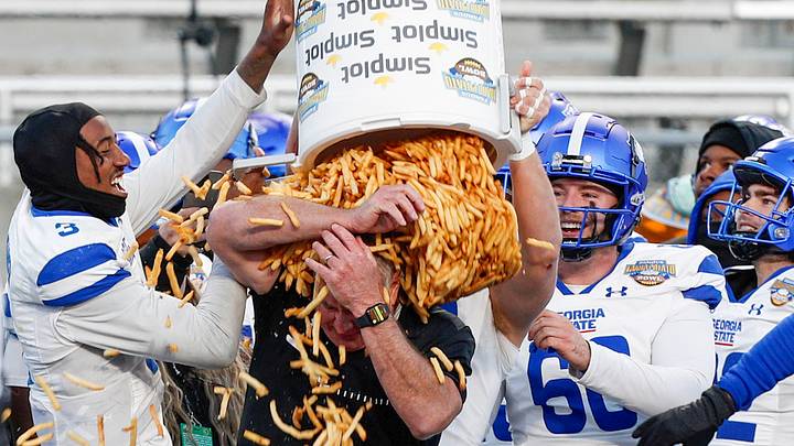 Which lucky college football coach will get a bucket of french fries dumped on him at the Potato Bowl this season? 