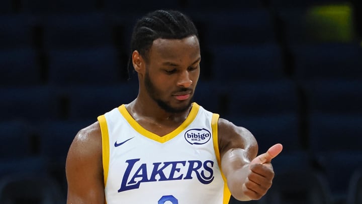 Los Angeles Lakers guard Bronny James Jr. checks his arm between plays against the Miami Heat Los Angeles Lakers guard Bronny James Jr. checks his arm between plays against the Miami Heat