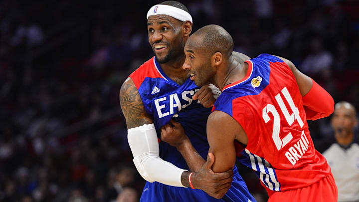 Feb 17, 2013; Houston, TX, USA; Western Conference guard Kobe Bryant (24) of the Los Angeles Lakers grabs onto Eastern Conference forward LeBron James (6) of the Miami Heat in the fourth quarter of the 2013 NBA all star game at the Toyota Center. Feb 17, 2013; Houston, TX, USA; Western Conference guard Kobe Bryant (24) of the Los Angeles Lakers grabs onto Eastern Conference forward LeBron James (6) of the Miami Heat in the fourth quarter of the 2013 NBA all star game at the Toyota Center.