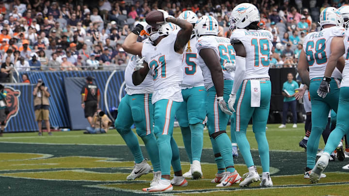 Aug 10, 2025; Chicago, Illinois, USA; Miami Dolphins running back Ollie Gordon II (31) celebrates his touchdown  against the Chicago Bears during the second half at Soldier Field. Mandatory Credit: David Banks-Imagn Images