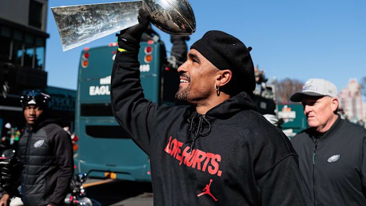 Philadelphia Eagles quarterback Jalen Hurts (1) celebrates with the Lombardi Trophy during the Super Bowl LIX championship parade and rally. 