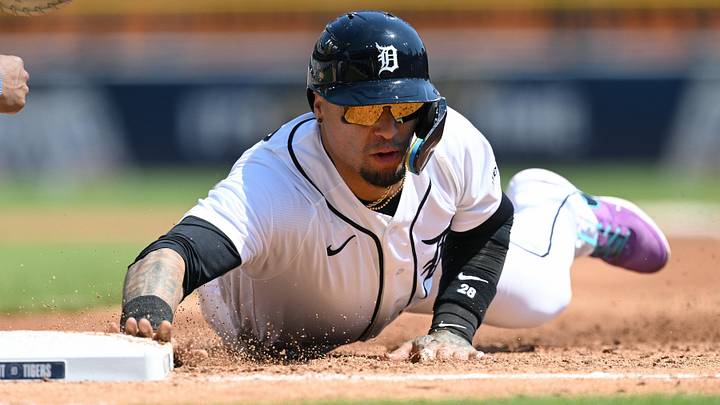 Detroit Tigers shortstop Javier Baez (28) dives safely back to first base on a pick-off attempt. Detroit Tigers shortstop Javier Baez (28) dives safely back to first base on a pick-off attempt.