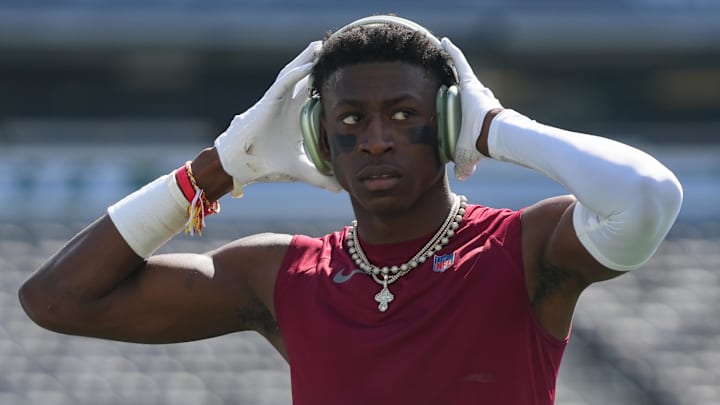 Aug 10, 2024; East Rutherford, New Jersey, USA; Washington Commanders cornerback Emmanuel Forbes (13) warms up before the game against the New York Jets at MetLife Stadium. Mandatory Credit: Lucas Boland-Imagn Images
