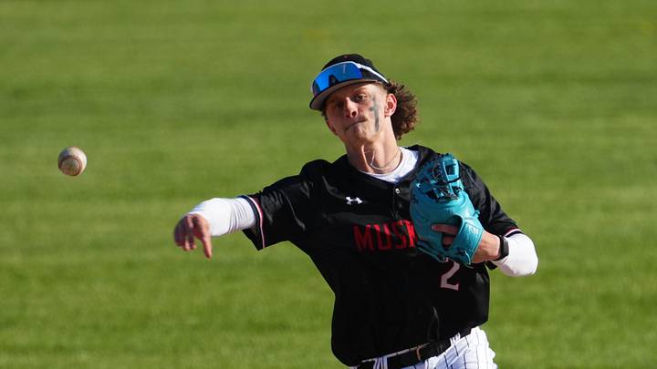 Muskego shortstop Kyle Rogosienski (2) throws to first during a Classic 8 Conference game at Mukwonago on May 6, 2026.