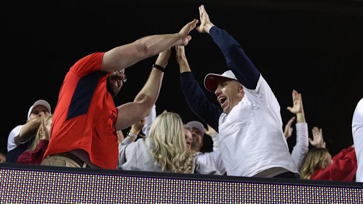 Nov 4, 2023; Tucson, Arizona, USA; Arizona Wildcats fans celebrate after a touchdown during the second half at Arizona Stadium. Mandatory Credit: Zachary BonDurant-Imagn Images Nov 4, 2023; Tucson, Arizona, USA; Arizona Wildcats fans celebrate after a touchdown during the second half at Arizona Stadium. Mandatory Credit: Zachary BonDurant-Imagn Images