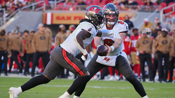 Nov 19, 2023; Santa Clara, California, USA; Tampa Bay Buccaneers quarterback Baker Mayfield (6) hands off the ball to Tampa Bay Buccaneers running back Rachaad White (1) for a touchdown run against the San Francisco 49ers during the fourth quarter at Levi's Stadium. Mandatory Credit: Kelley L Cox-Imagn Images