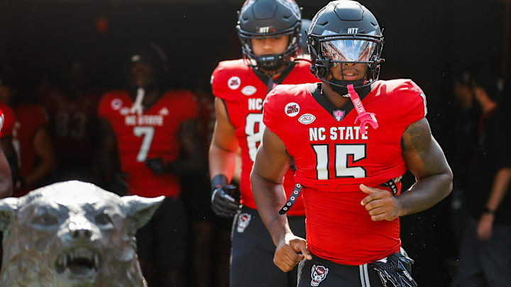 Oct 5, 2024; Raleigh, North Carolina, USA; North Carolina State Wolfpack cornerback Tamarcus Cooley (15) runs out prior to the first half of the game against Wake Forest Demon Deacons at Carter-Finley Stadium. Mandatory Credit: Jaylynn Nash-Imagn Images Oct 5, 2024; Raleigh, North Carolina, USA; North Carolina State Wolfpack cornerback Tamarcus Cooley (15) runs out prior to the first half of the game against Wake Forest Demon Deacons at Carter-Finley Stadium. Mandatory Credit: Jaylynn Nash-Imagn Images
