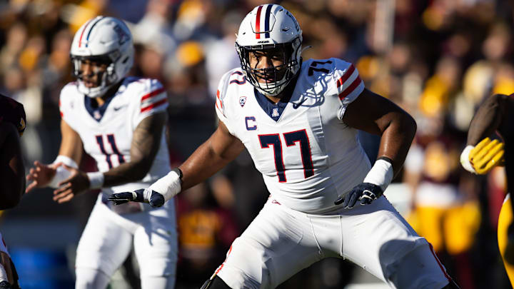 Nov 25, 2023; Tempe, Arizona, USA; Arizona Wildcats offensive lineman Jordan Morgan (77) against the Nov 25, 2023; Tempe, Arizona, USA; Arizona Wildcats offensive lineman Jordan Morgan (77) against the
