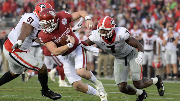 Jan 1, 2018; Pasadena, CA, USA; Oklahoma Sooners quarterback Baker Mayfield (6) is sacked by Georgia Bulldogs linebacker Lorenzo Carter (7) the 2018 Rose Bowl college football playoff semifinal game at Rose Bowl Stadium. Georgia defeated Oklahoma 54-48 in two overtimes. Mandatory Credit: Kirby Lee-Imagn Images Jan 1, 2018; Pasadena, CA, USA; Oklahoma Sooners quarterback Baker Mayfield (6) is sacked by Georgia Bulldogs linebacker Lorenzo Carter (7) the 2018 Rose Bowl college football playoff semifinal game at Rose Bowl Stadium. Georgia defeated Oklahoma 54-48 in two overtimes. Mandatory Credit: Kirby Lee-Imagn Images