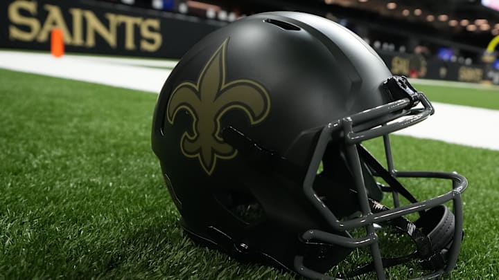 Oct 26, 2025; New Orleans, Louisiana, USA; A New Orleans Saints helmet is seen on the field prior to a game against the Tampa Bay Buccaneers at Caesars Superdome. Oct 26, 2025; New Orleans, Louisiana, USA; A New Orleans Saints helmet is seen on the field prior to a game against the Tampa Bay Buccaneers at Caesars Superdome.