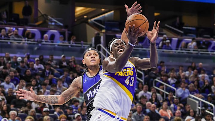 Jan 4, 2026; Orlando, Florida, USA; Indiana Pacers forward Pascal Siakam (43) is fouled by Orlando Magic forward Paolo Banchero (5) during the second half at Kia Center. Mandatory Credit: Mike Watters-Imagn Images