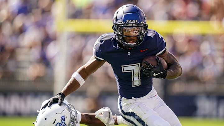 Aug 30, 2025; East Hartford, Connecticut, USA; Connecticut Huskies running back Mel Brown (7) runs the ball against the Central Connecticut State Blue Devils in the first half at Pratt & Whitney Stadium at Rentschler Field. Mandatory Credit: David Butler II-Imagn Images