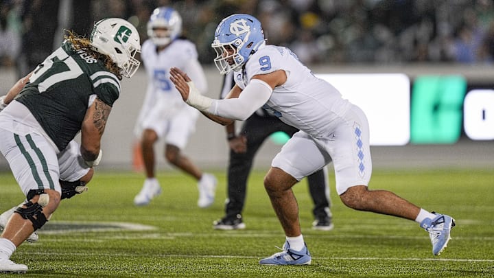Sep 6, 2025; Charlotte, North Carolina, USA; North Carolina Tar Heels defensive lineman Melkart Abou-Jaoude (9) rushes against Charlotte 49ers offensive lineman Mason Bowers (57) during the first quarter at Jerry Richardson Stadium. Mandatory Credit: Jim Dedmon-Imagn Images