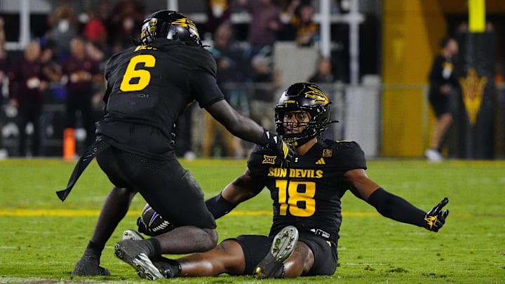 Arizona State linebacker Martell Hughes (18) celebrates with safety Adrian Wilson (6) after the game-sealing interception against TCU during a game at Mountain America Stadium in Tempe on Sept. 26, 2025.
