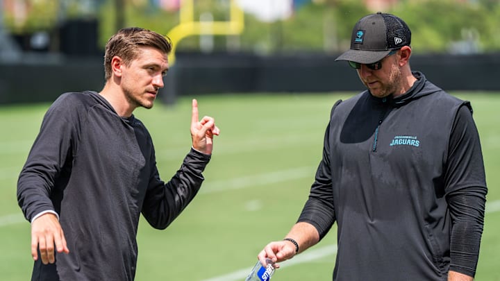 Jacksonville Jaguars general manager James Gladstone, left, talks with Jacksonville Jaguars head coach Liam Coen, right, after the. Jacksonville Jaguars’ mandatory minicamp Tuesday June 10, 2025 at the Miller Electric Center in Jacksonville, Fla. [Doug Engle/Florida Times-Union]