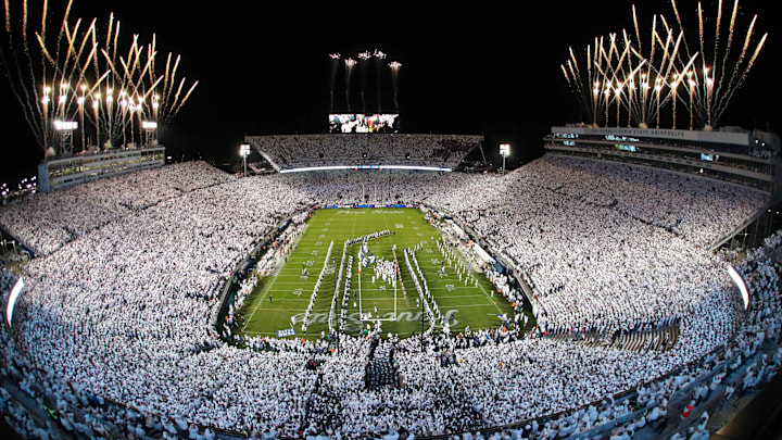 Fireworks burst over Beaver Stadium as the Penn State Nittany Lions take the field prior to the 2024 "White Out" game against the Washington Huskies. 