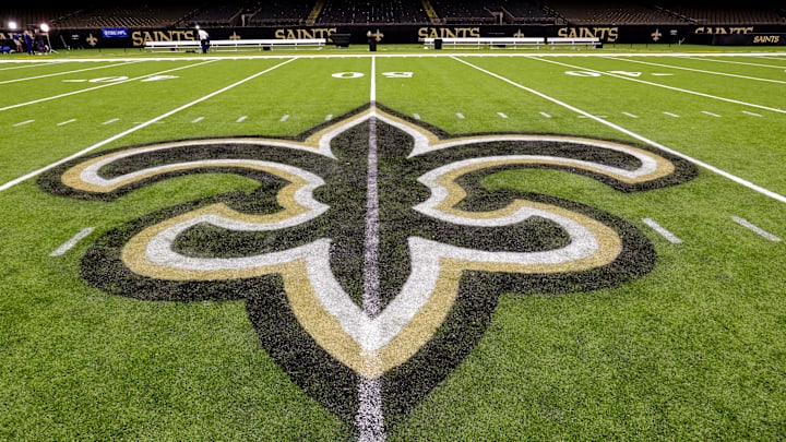 Oct 30, 2022; New Orleans, Louisiana, USA; General view of the New Orleans Saints logo as the midfield logo fleur-de-lis after the game between the New Orleans Saints and the Las Vegas Raiders at Caesars Superdome. Mandatory Credit: Stephen Lew-Imagn Images Oct 30, 2022; New Orleans, Louisiana, USA; General view of the New Orleans Saints logo as the midfield logo fleur-de-lis after the game between the New Orleans Saints and the Las Vegas Raiders at Caesars Superdome. Mandatory Credit: Stephen Lew-Imagn Images
