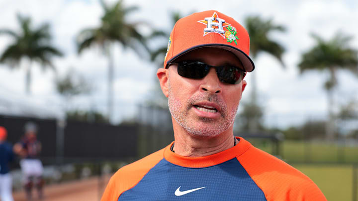 Houston Astros manager Joe Espada (19) speaks to reporters before a spring training workout. Houston Astros manager Joe Espada (19) speaks to reporters before a spring training workout.