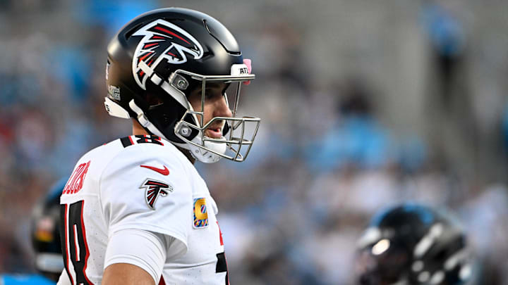 Oct 13, 2024; Charlotte, North Carolina, USA;  Atlanta Falcons quarterback Kirk Cousins (18) reacts after a play in the second quarter at Bank of America Stadium. Mandatory Credit: Bob Donnan-Imagn Images