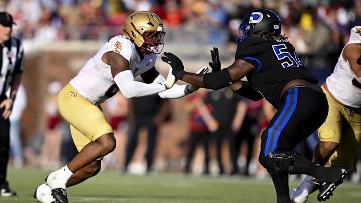 Nov 16, 2024; Dallas, Texas, USA; Boston College Eagles defensive end Donovan Ezeiruaku (6) and SMU Mustangs offensive lineman Savion Byrd (54) in action during the game between the SMU Mustangs and the Boston College Eagles at Gerald J. Ford Stadium. Mandatory Credit: Jerome Miron-Imagn Images