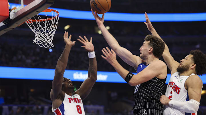 Apr 25, 2026; Orlando, Florida, USA; Orlando Magic forward Franz Wagner (22) drives to the basket guarded by Detroit Pistons center Jalen Duren (0) in the fourth quarter during game three of the first round of the 2026 NBA Playoffs at Kia Center. Mandatory Credit: Nathan Ray Seebeck-Imagn Images